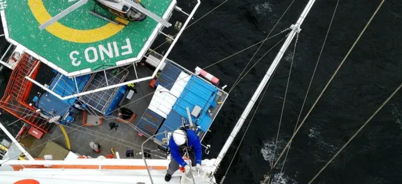 Crew working on a research vessel at sea